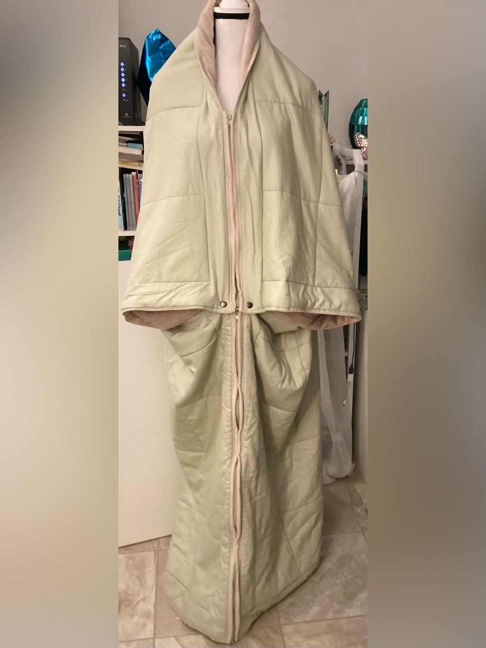 Wrap wearable stadium throw/blanket with zippers and snap buttons.